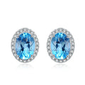 925 sterling silver geometric jewellery set with Blue Topaz gems showing necklace, earrings, ring, and pendant