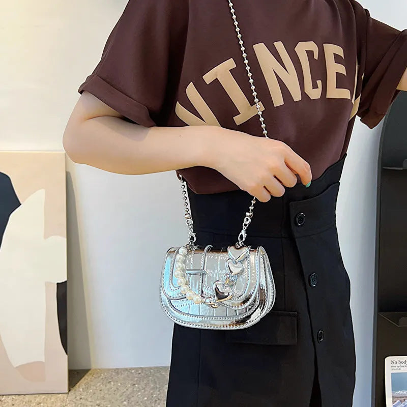 Women's mini saddle crossbody bag in horizontal square design with single shoulder strap