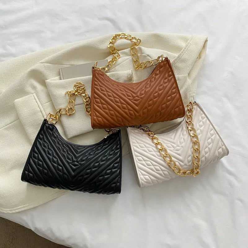 Black PU leather vertical square shoulder bag with chain strap, soft handle, and 3D outer pockets