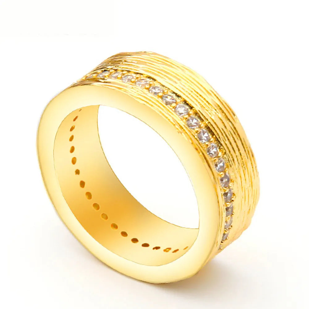 Gold geometric zircon ring on display showing angular design and available UK sizes 6-8