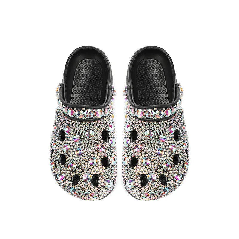 Black women's platform sandals with rhinestone decoration and multiple air holes on a white background.