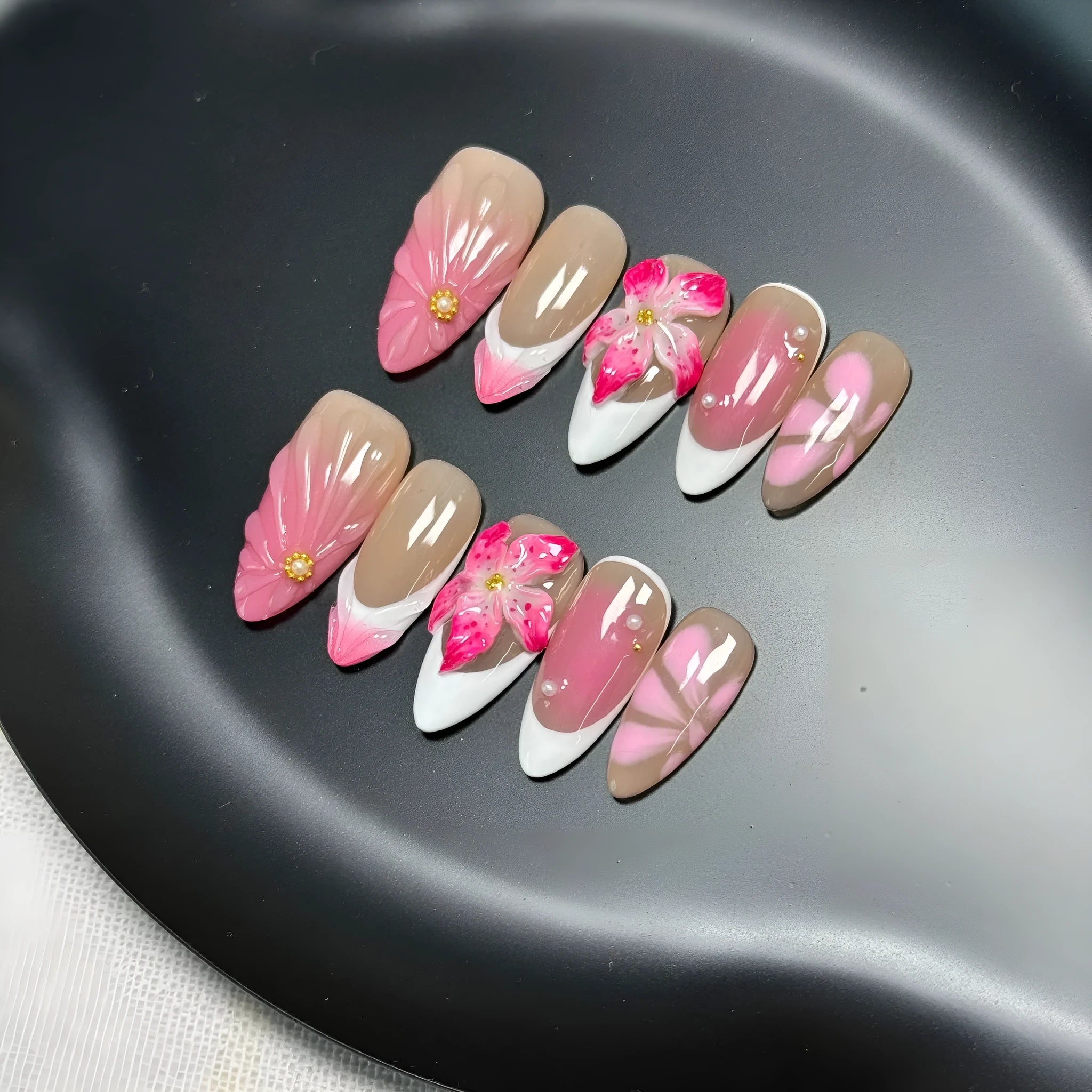 French style lily and fluid ice flower designs on transparent plastic wearable nail armour pieces in four sizes
