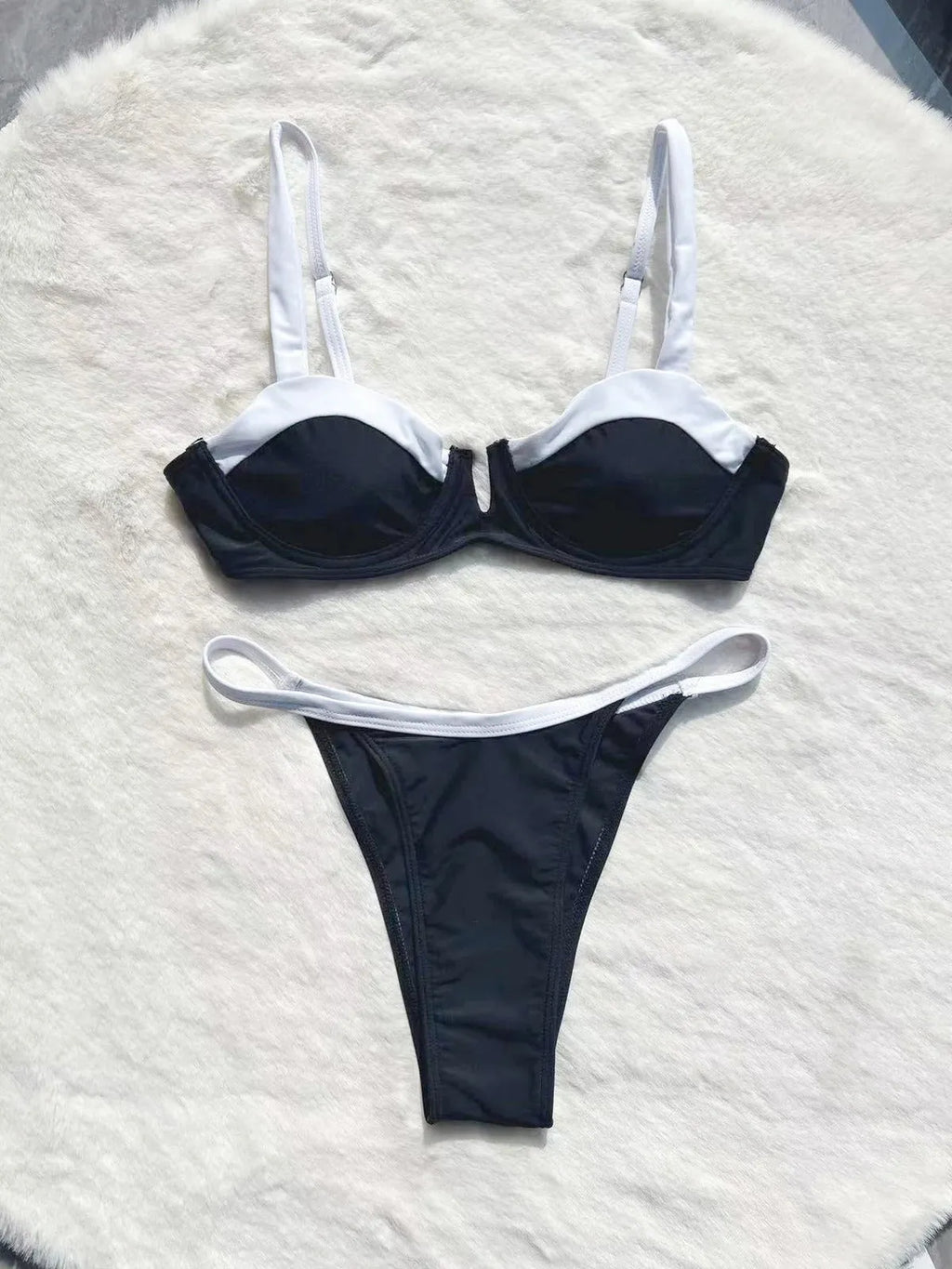 Black low waist women's bikini swimsuit briefs with split stitching detail