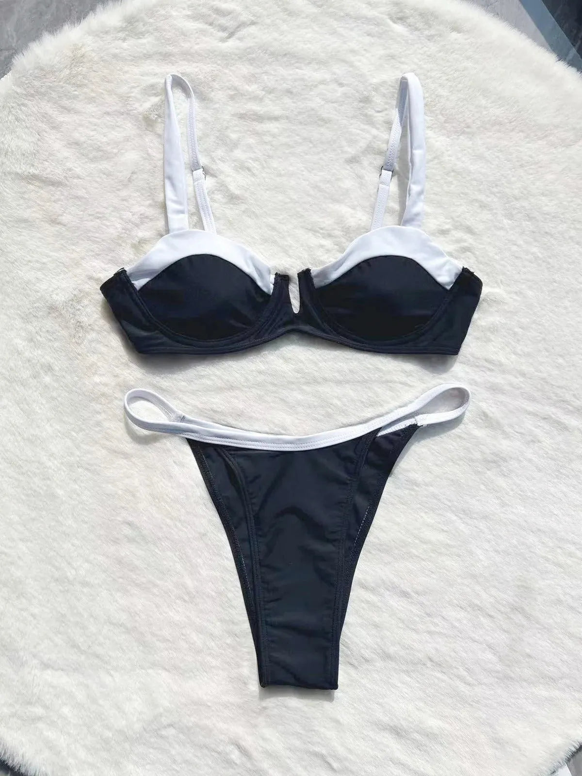 Black low waist women's bikini swimsuit briefs with split stitching detail