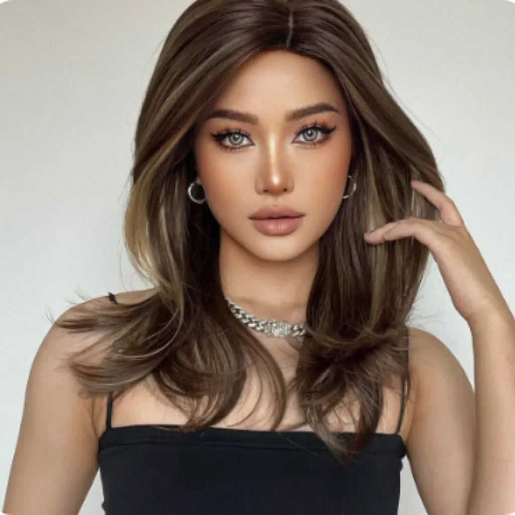 Mid-length curly full-head wig in a platinum gradient colour on a mannequin head.