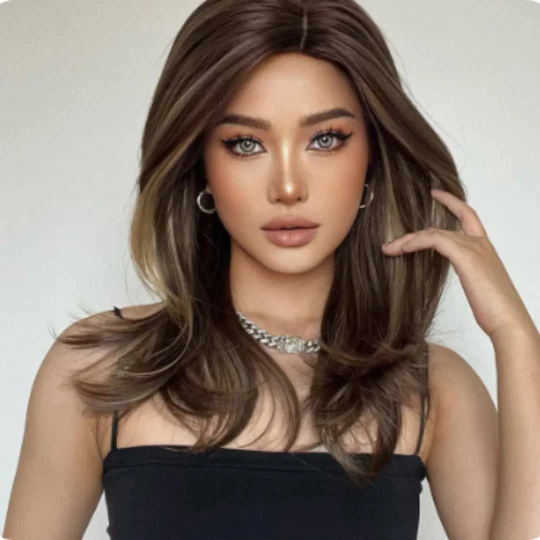 Mid-length curly full-head wig in a platinum gradient colour on a mannequin head.