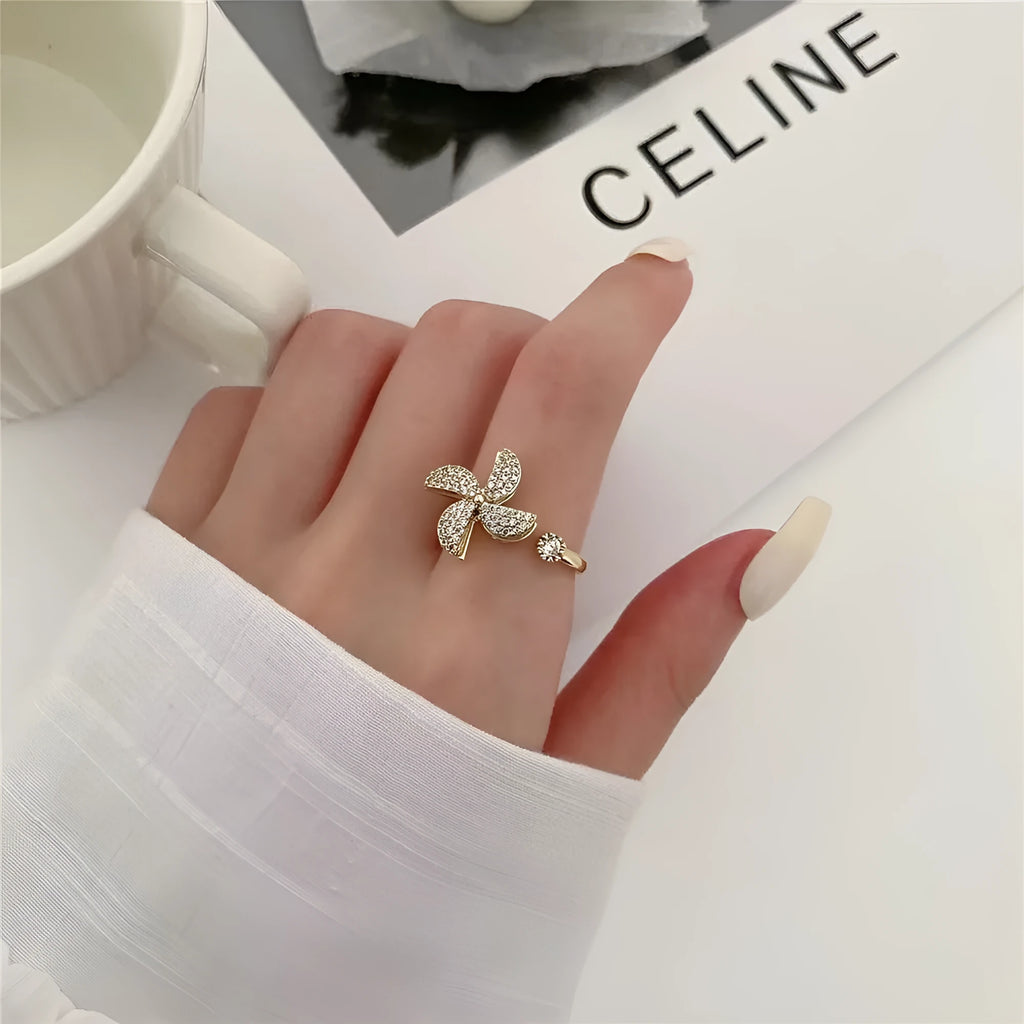 Geometric rotating ring with micro inlaid details in gold or silver electroplated finish