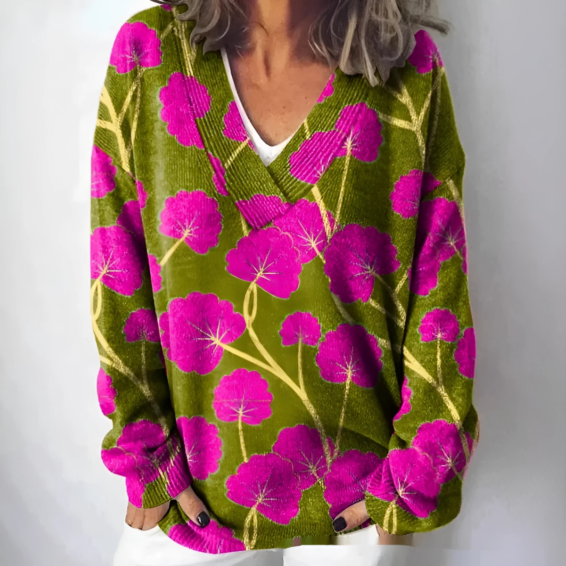 Women's V-neck sweatshirt with a white background and a textured 3D floral printed pattern.