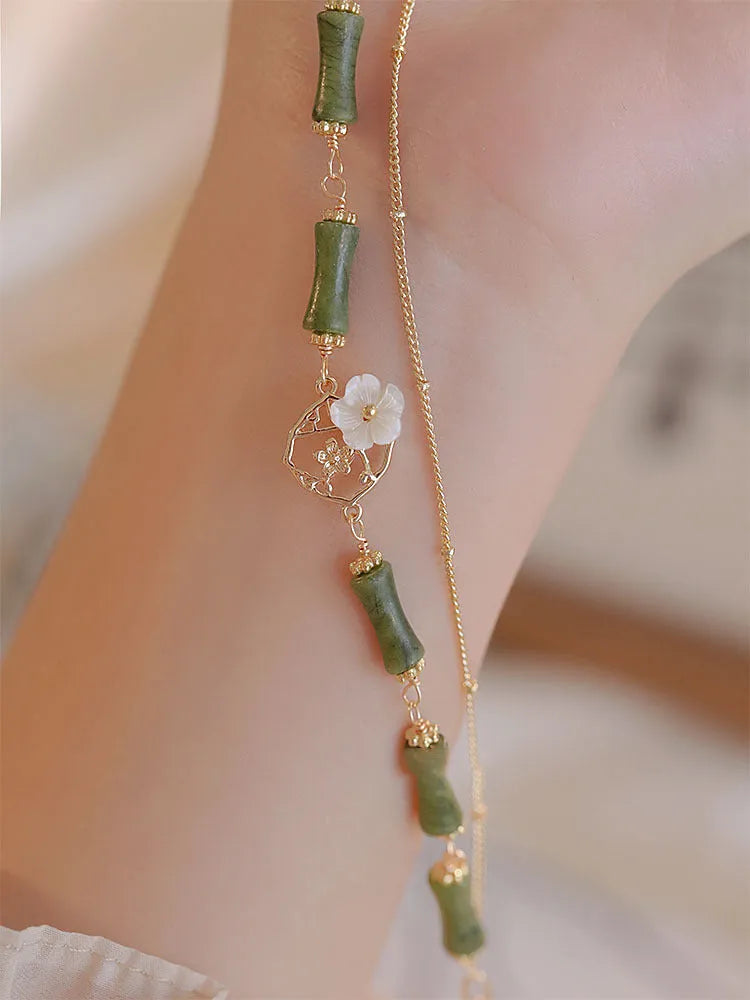 Handmade natural olivine bracelet with double layer Twin Bells of Ireland design and olive branch elements