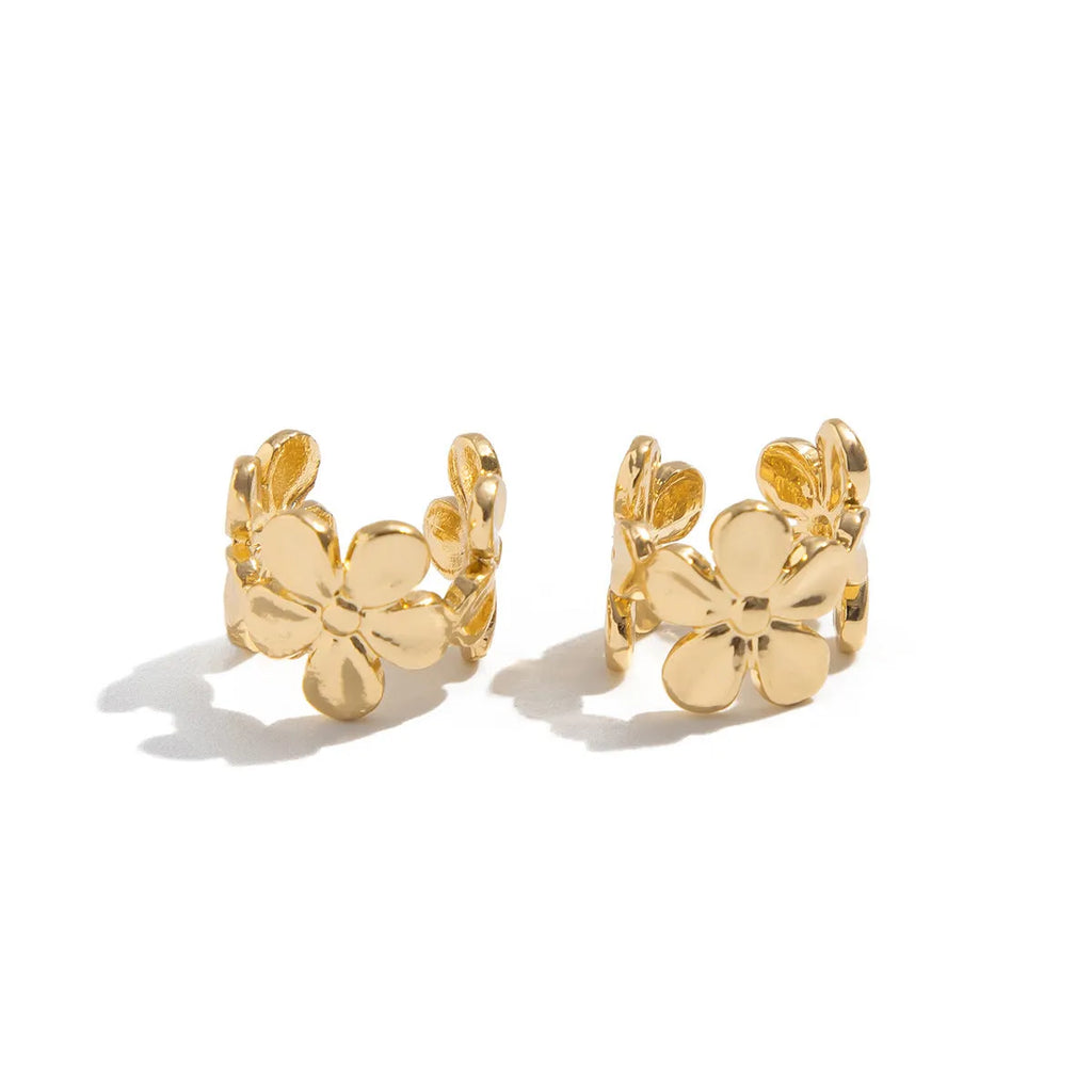 Gold starfish and conch shell earrings with electroplated finish and detailed coastal designs