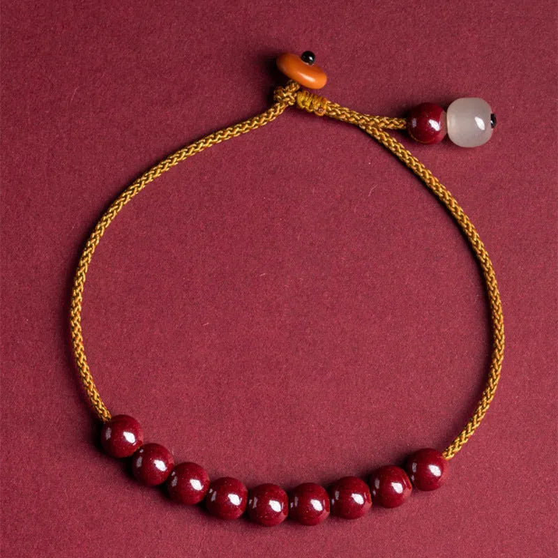 Hand-woven cinnabar bracelet with geometric design and traditional Chinese style