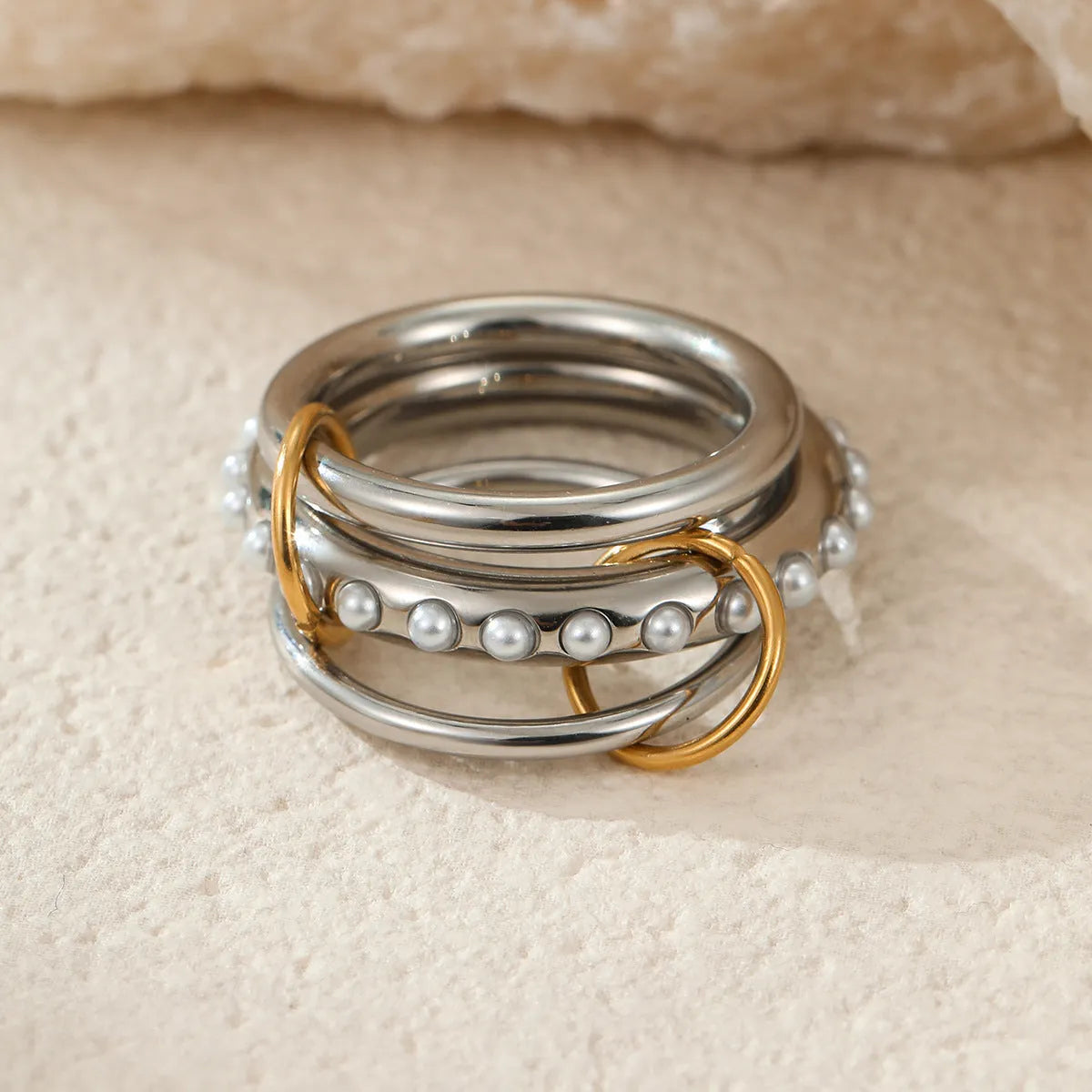 Stacked stainless steel rings with 18K gold plating in three colour options for women's hand jewellery