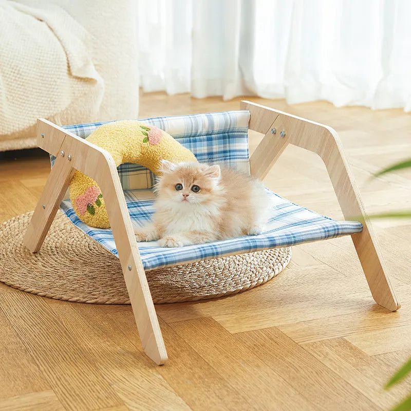 Wooden frame cat hammock bed with blue cloth fabric, elevated design for indoor cats.