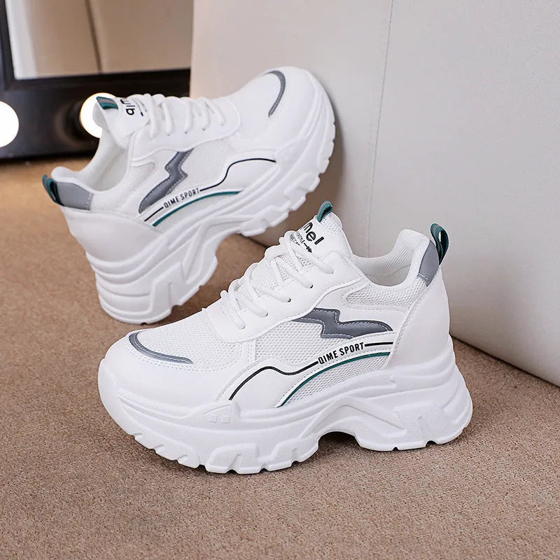 Breathable white and beige women's dad shoes with cross strap and flat rubber sole.