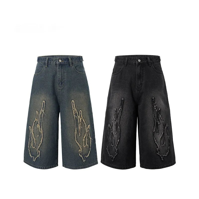 Men's black denim shorts with flame embroidery patch detail on straight leg casual cut