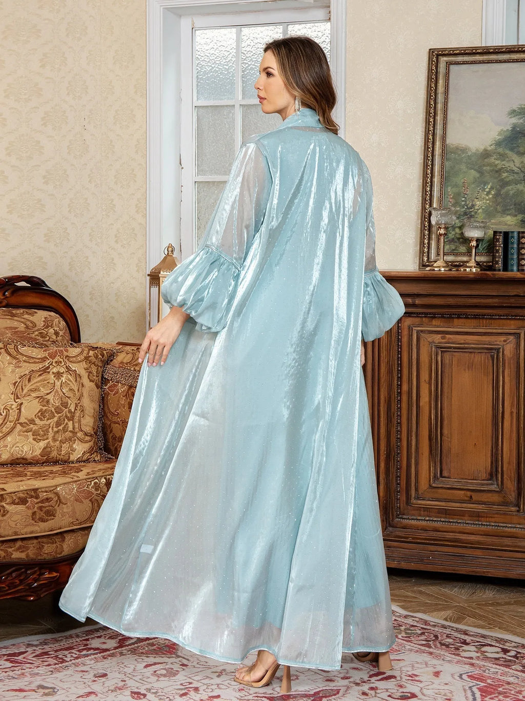 Blue Arabic style two-piece dress with long sleeves, long skirt, and rhinestone decoration.