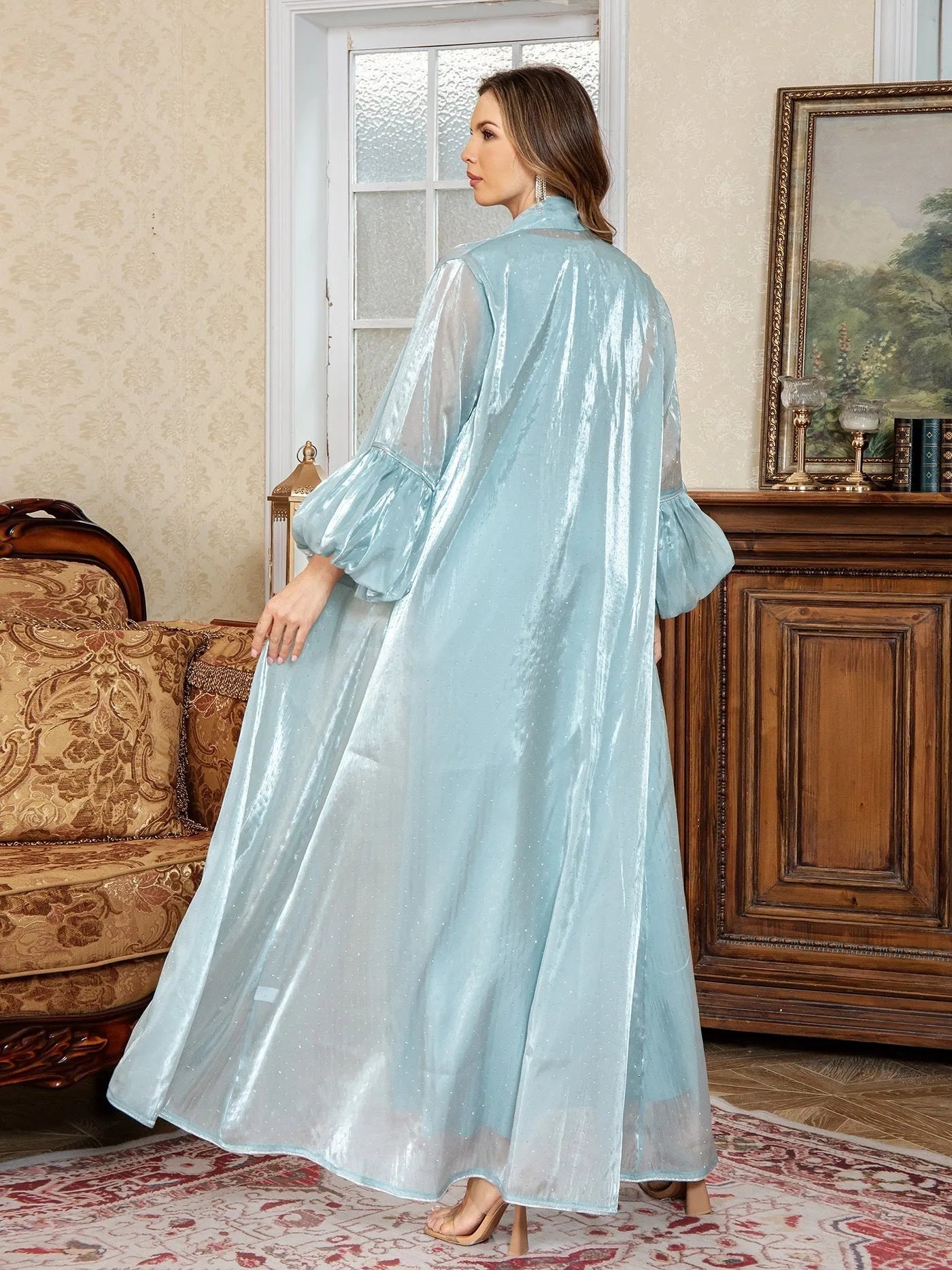 Blue Arabic style two-piece dress with long sleeves, long skirt, and rhinestone decoration.