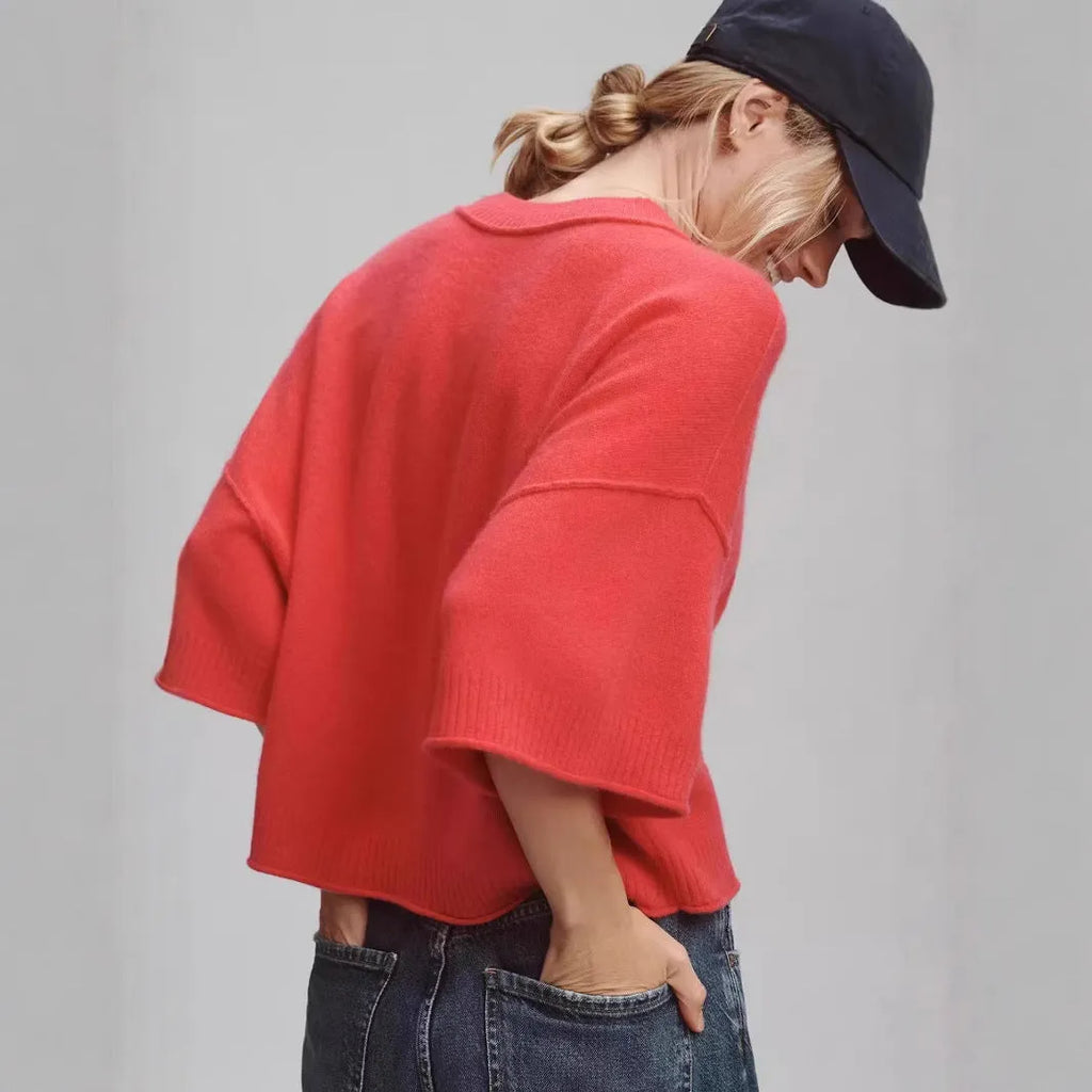 Red cropped short sleeve T-shirt with an exposed navel design on a mannequin.