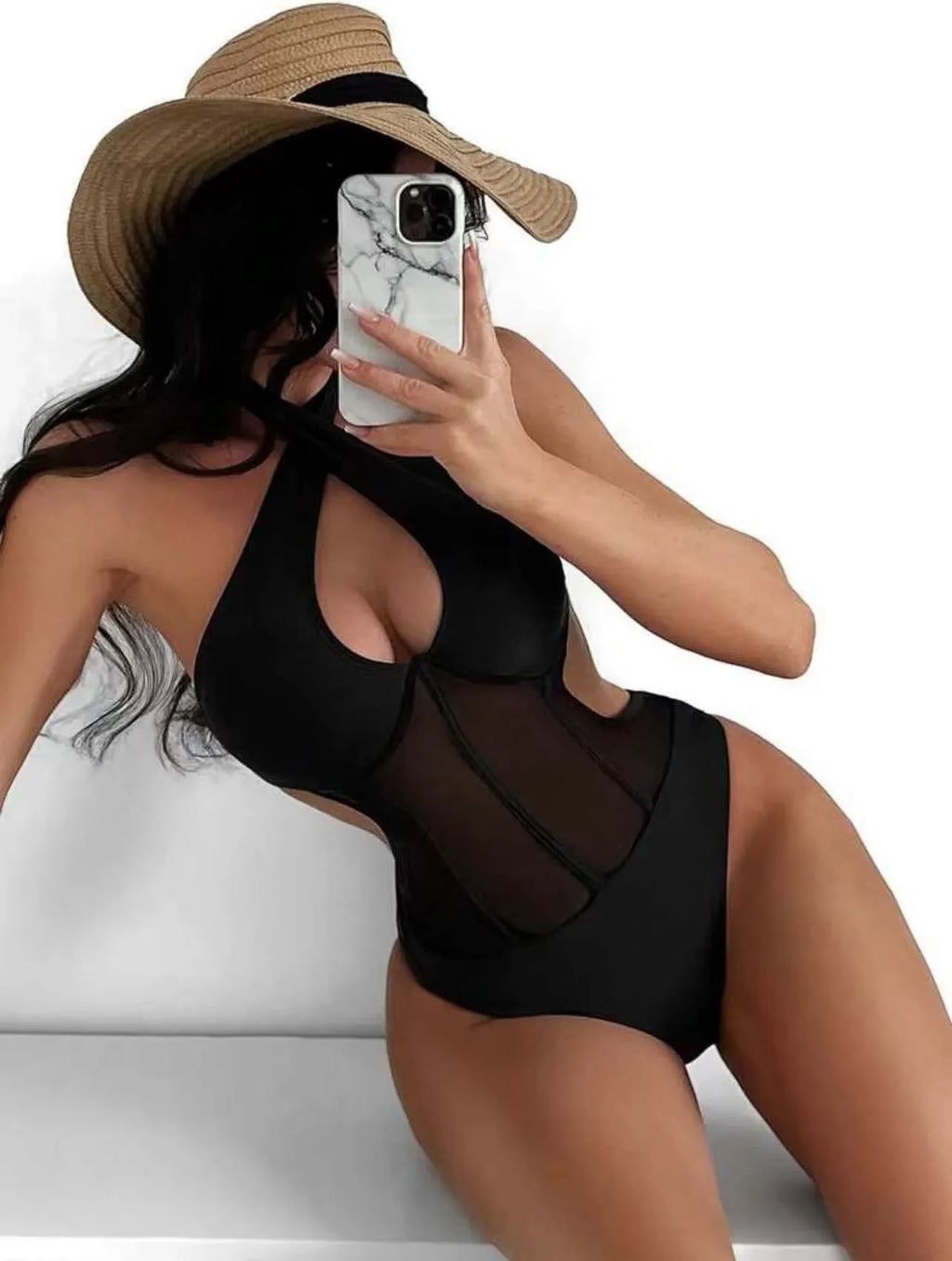 Women's black one-piece swimsuit made from nylon and spandex fabric on size mannequin