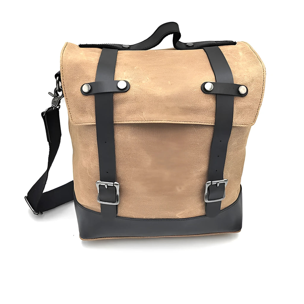 Waterproof canvas motorcycle side bag in black with cowhide accents and mounting straps