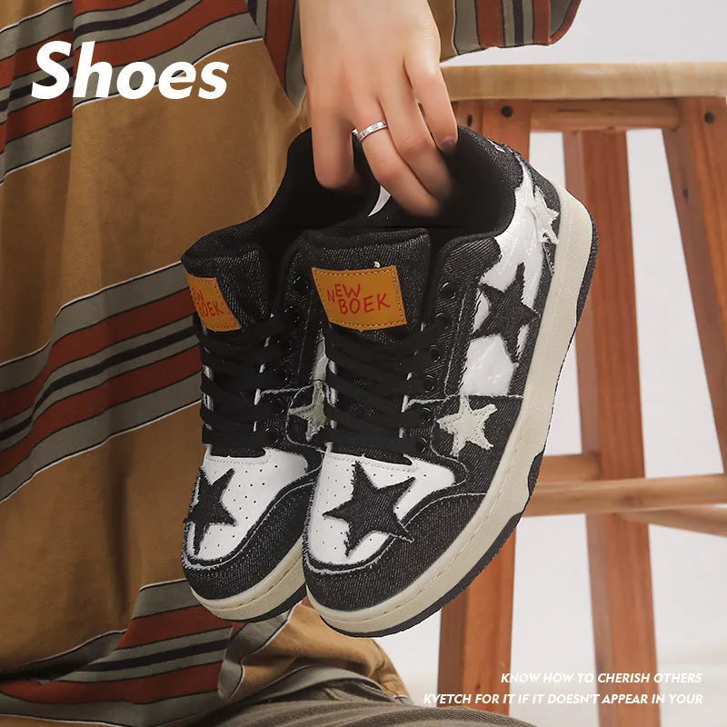 Denim skateboard shoes in black with mesh lining, rubber sole, and decorative stitching
