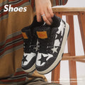 Denim skateboard shoes in black with mesh lining, rubber sole, and decorative stitching