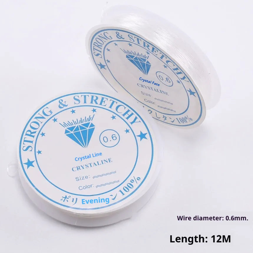 Transparent white elastic fishing line on spool for jewellery making and DIY crafts