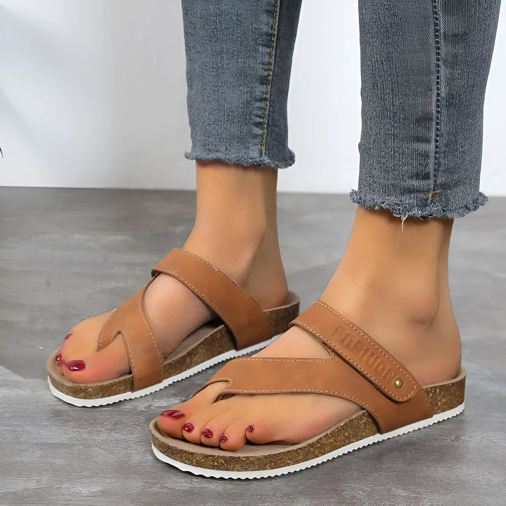 Thick-soled foam flip-flops with a flat toe ring in blue, shown on a white background.