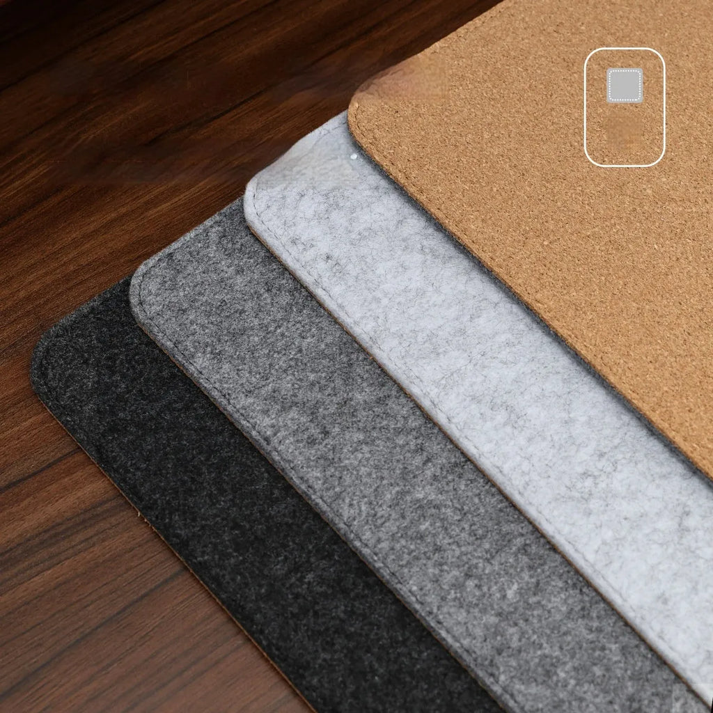 Winter warm grey and black felt desk mouse mat with cork non-slip base on a wooden table.