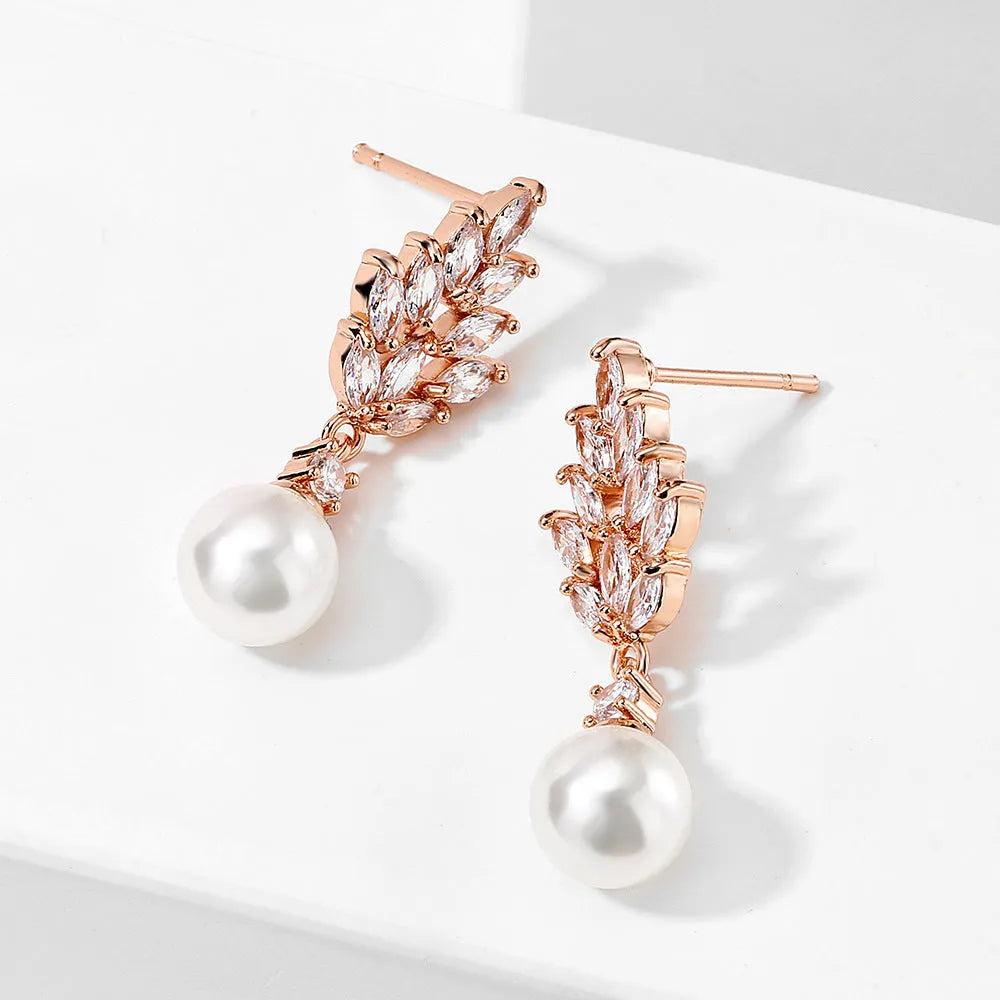 Geometric floral earrings with micro-set zircon stones in gold, platinum, or rose gold plating.