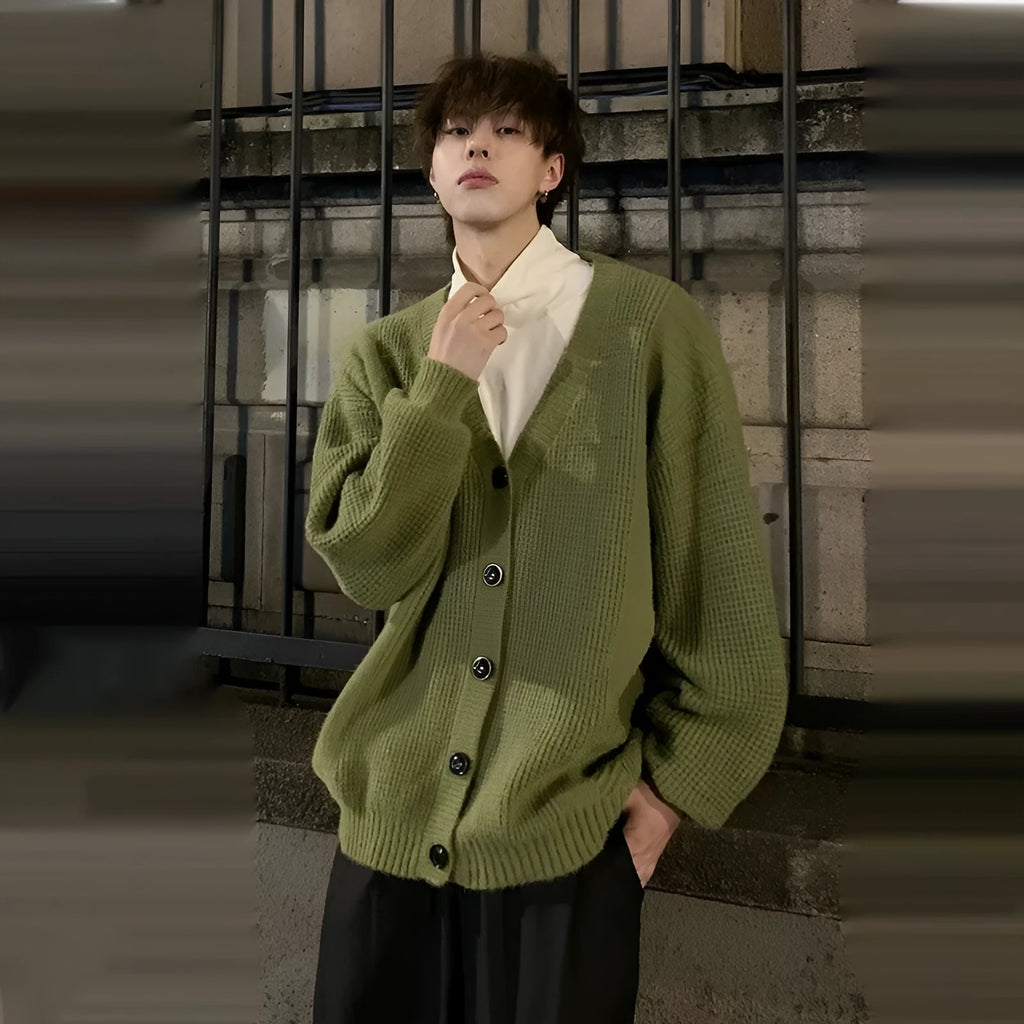 Army green men's V-neck knitted cardigan with long sleeves on a hanger