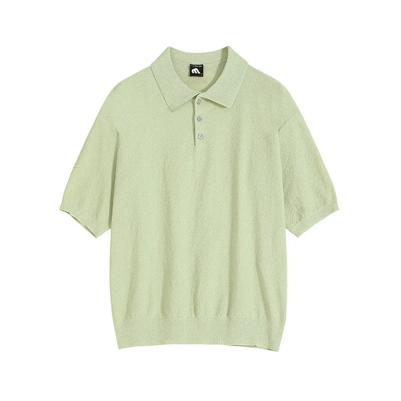 Man wearing a caramel-coloured retro knitted polo shirt with short sleeves and an asymmetric design detail.
