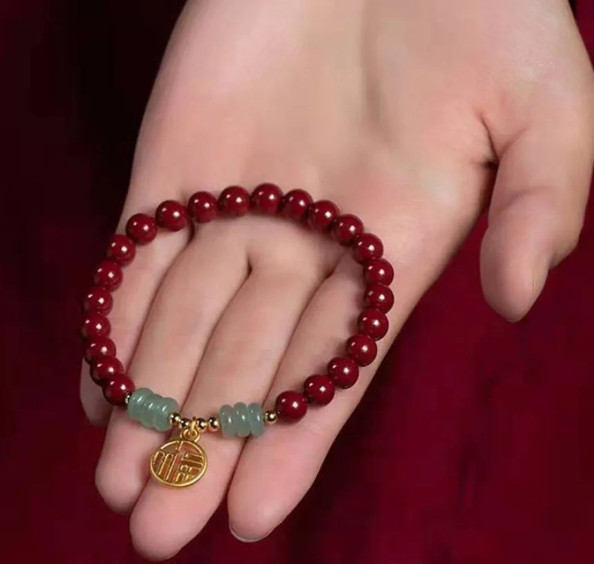 Handcrafted cinnabar bracelet with wave pattern design and copper bead accents in traditional Chinese style