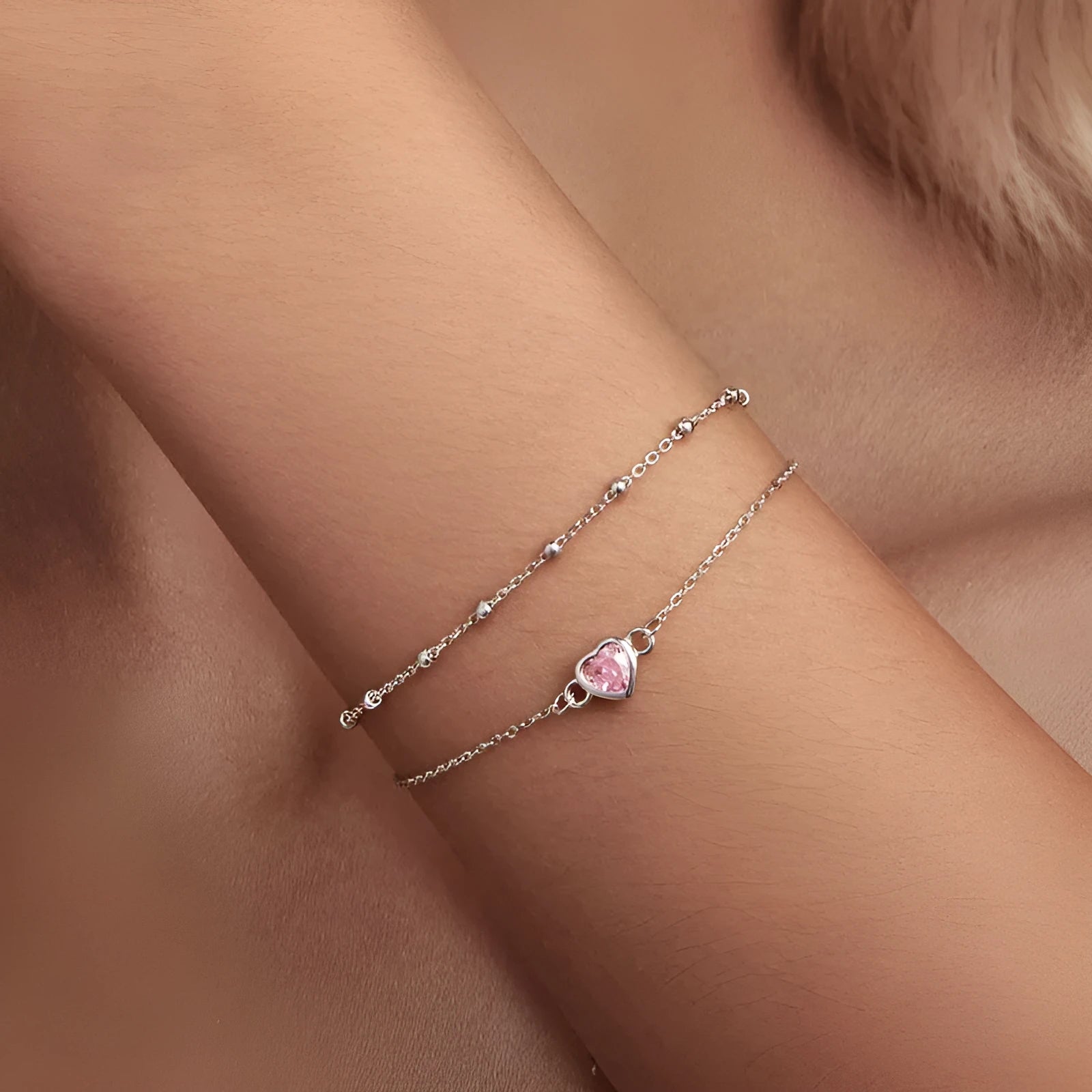 Sweet girlish style 925 sterling silver bracelet with a small heart-shaped charm on a chain.