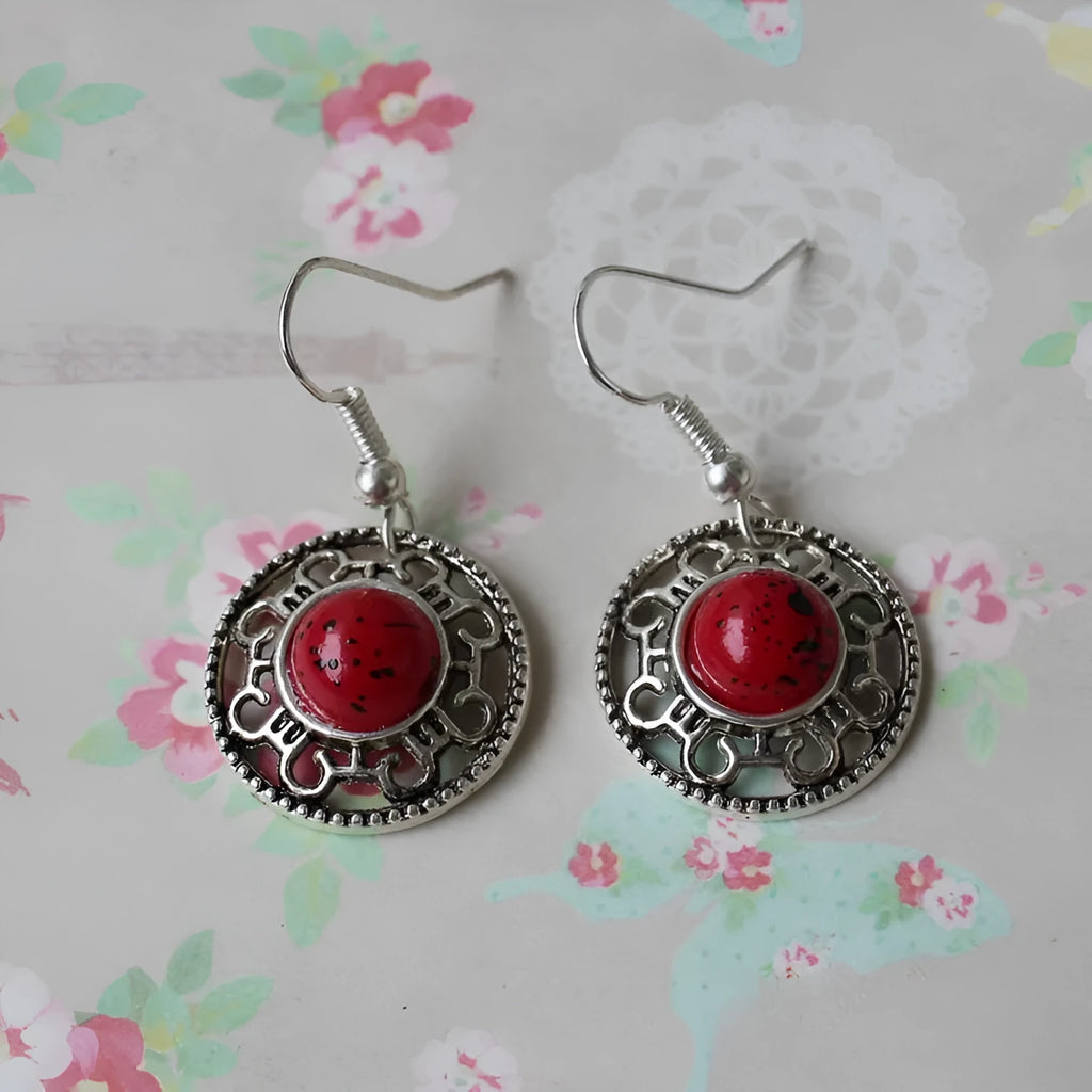 Handmade Miao silver earrings with turquoise flower disk design and ethnic totem patterns in red blue or black colour options