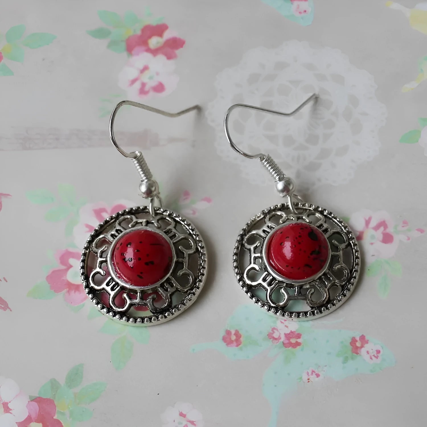 Handmade Miao silver earrings with turquoise flower disk design and ethnic totem patterns in red blue or black colour options