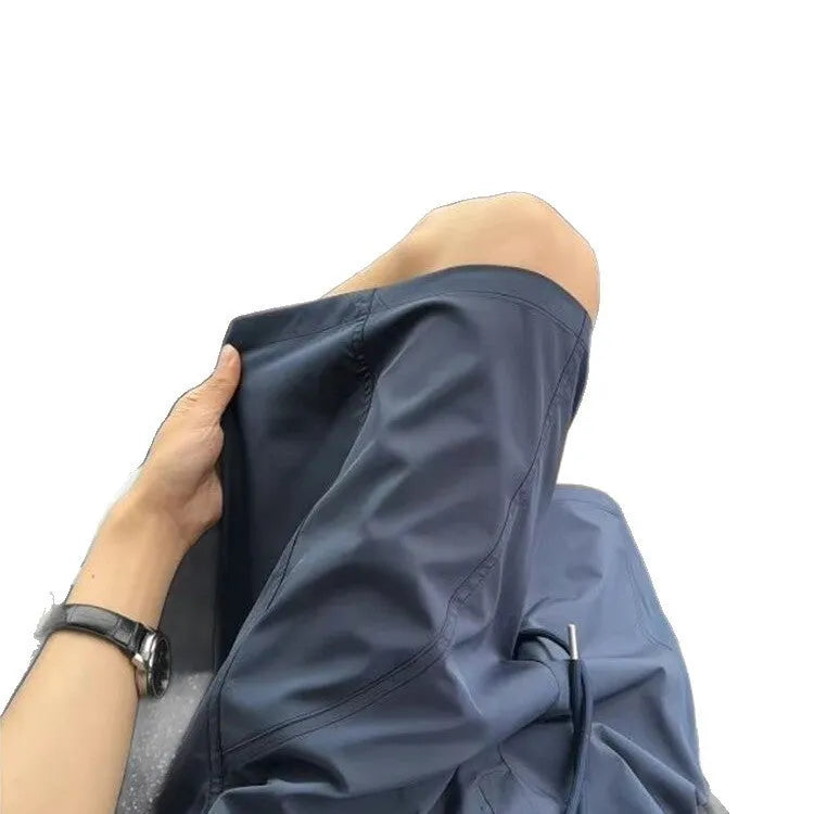Men's quick-drying polyester sports shorts in straight leg style, available in creamy-white, black and navy blue