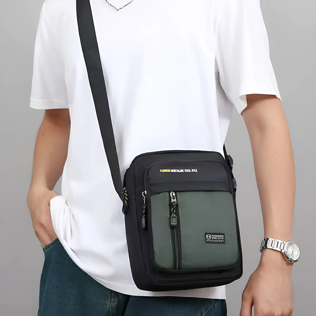 Men's casual nylon messenger bag in crossbody style with sewing thread detail.