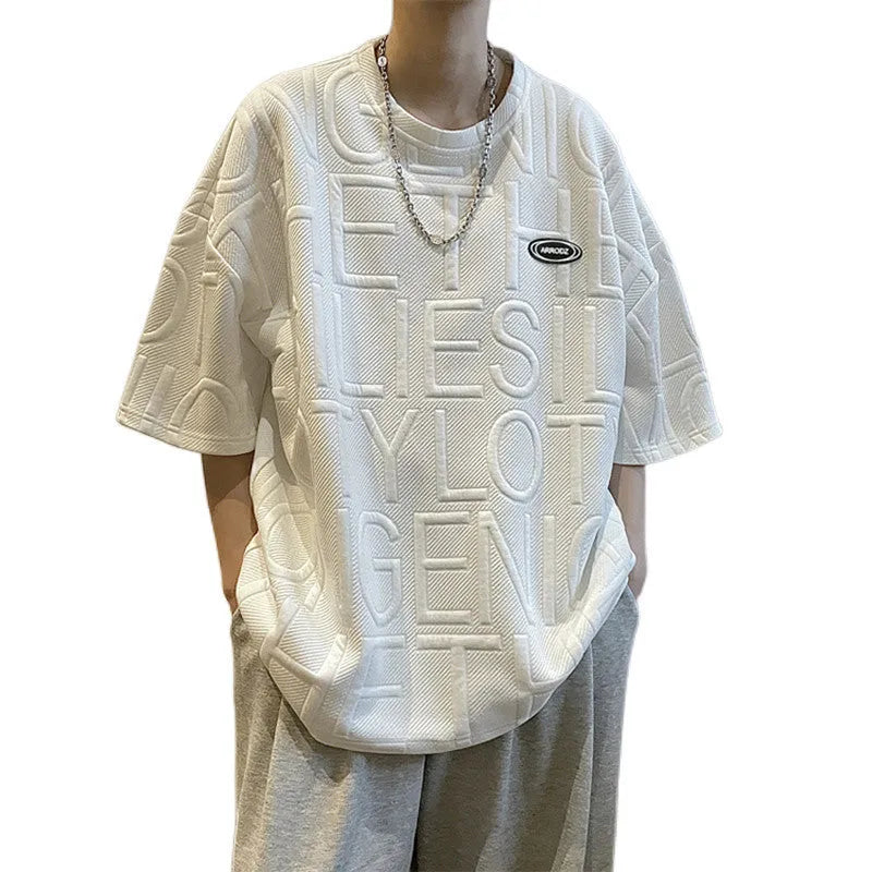 Men's grey loose fit T-shirt with a three-dimensional retro letter pattern on the front.