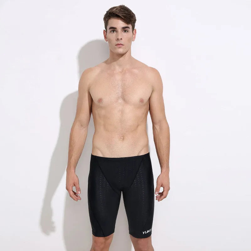 Men's black swimming set with trunks, anti-fog goggles, waterproof cap, ear plugs with nose clip, and storage bag