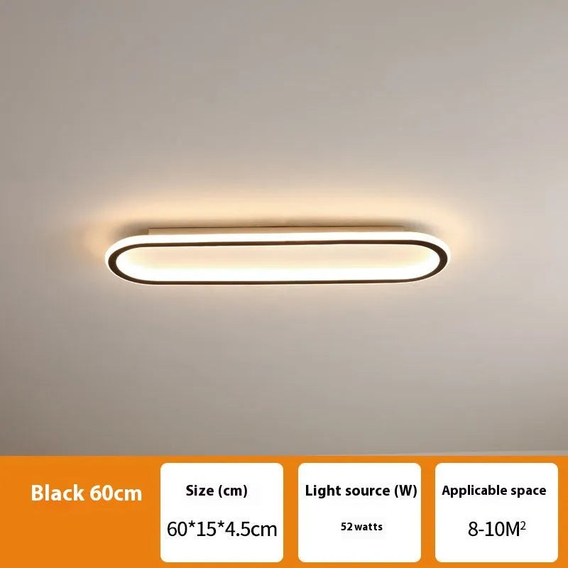 Minimalist aluminium strip ceiling lamp in black finish, shown mounted on a white ceiling.