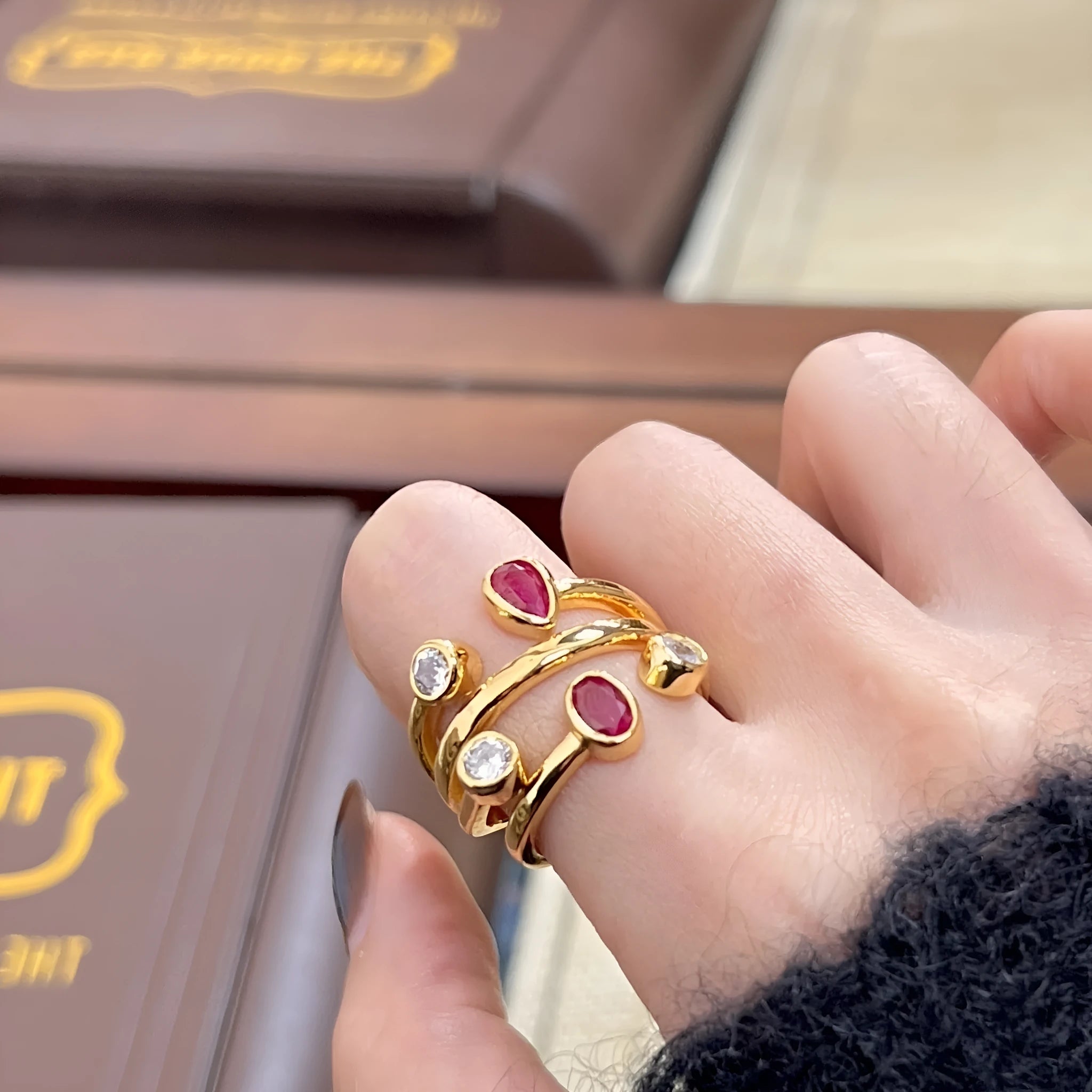 Copper double-headed diamond ring with irregular geometric shape in red and white two-tone colour.