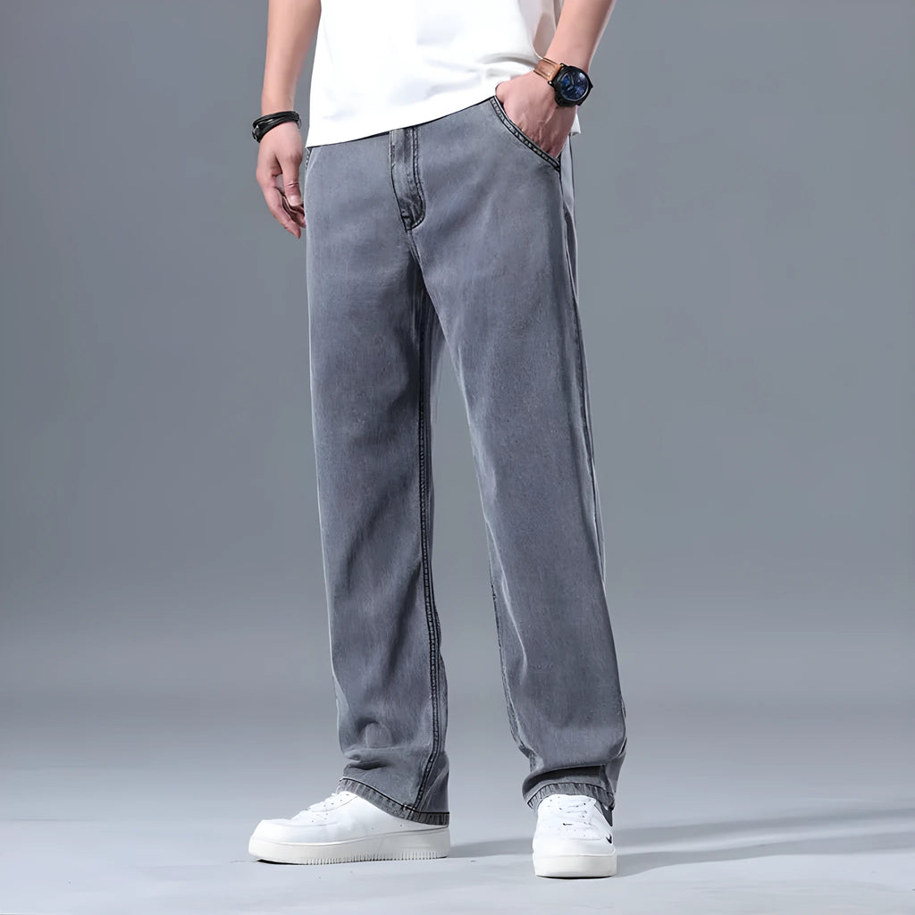 Men's loose straight-leg lyocell jeans in light blue colour showing zipper fly and relaxed fit