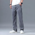 Men's loose straight-leg lyocell jeans in light blue colour showing zipper fly and relaxed fit
