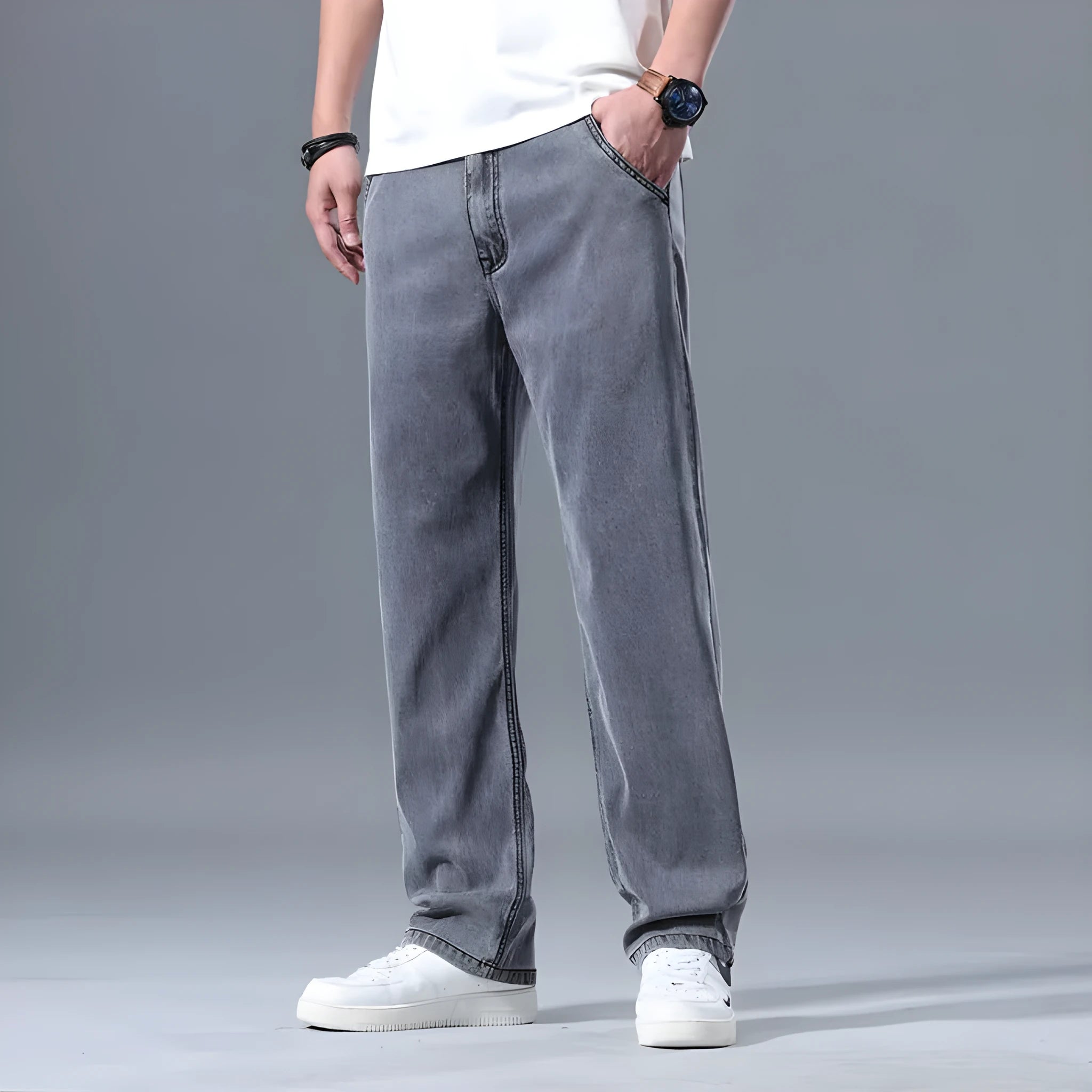 Men's loose straight-leg lyocell jeans in light blue colour showing zipper fly and relaxed fit