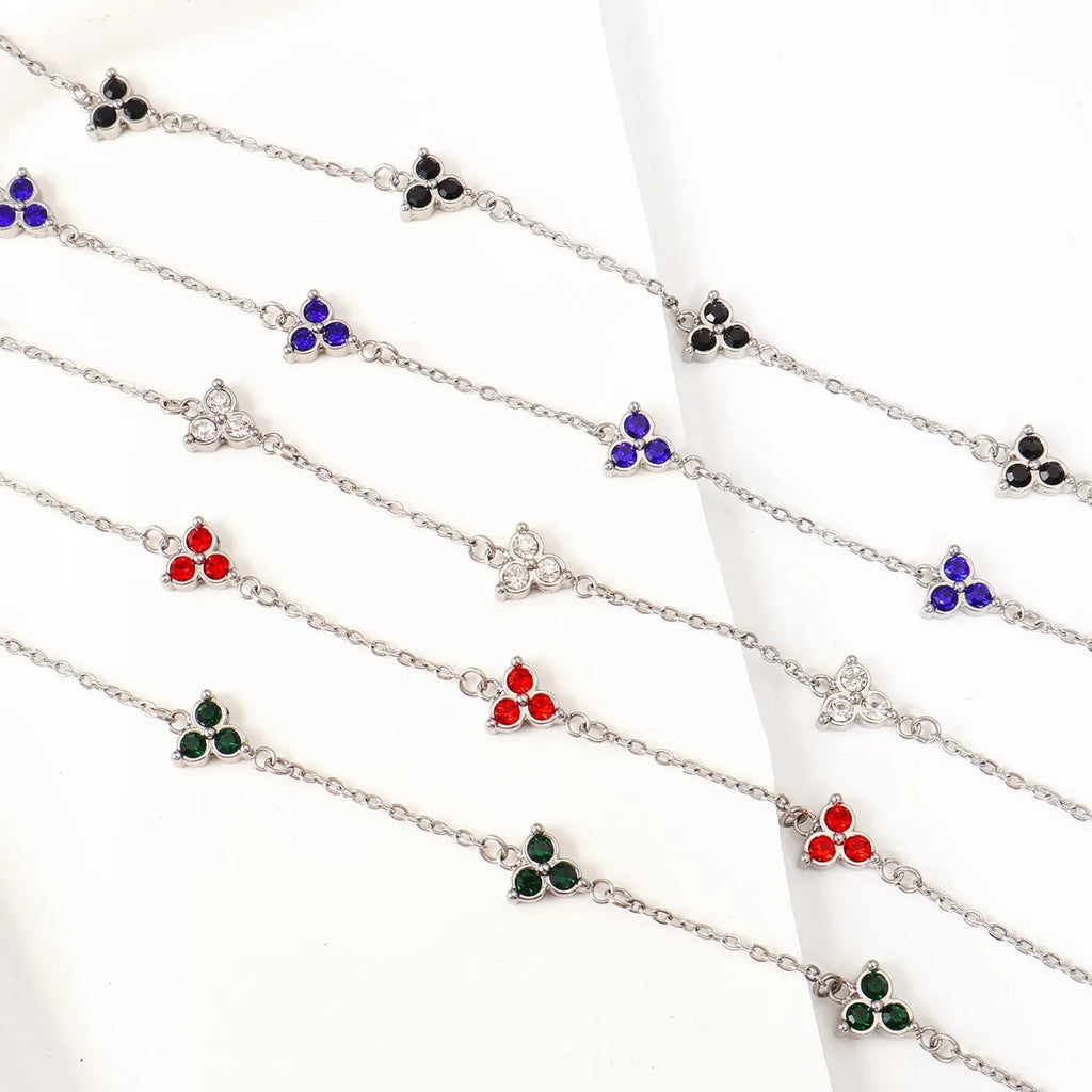 Stainless steel women's bracelet with three geometric diamond charms and zircon gemstones