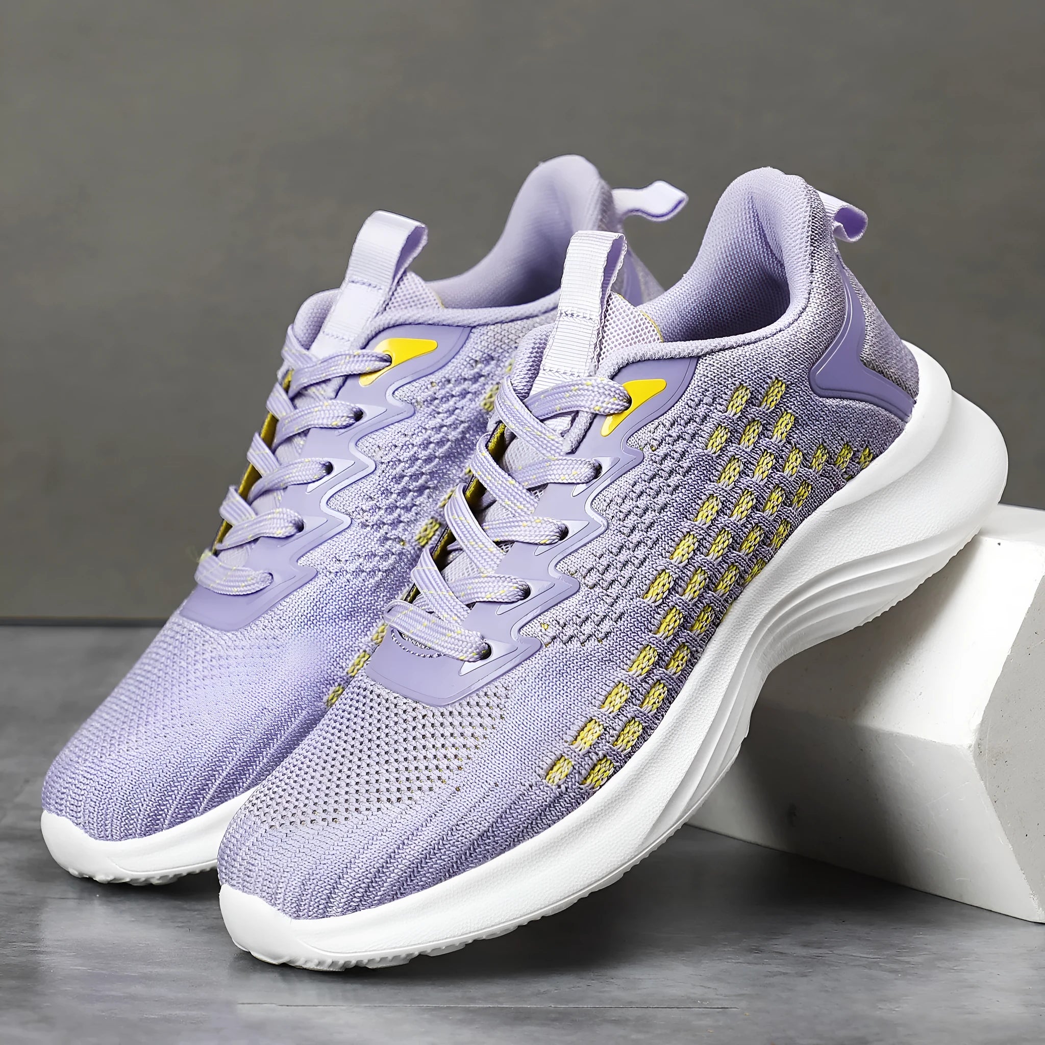 Women's Lavender Purple Flyknit running shoes with striped pattern and mesh upper on EVA sole.