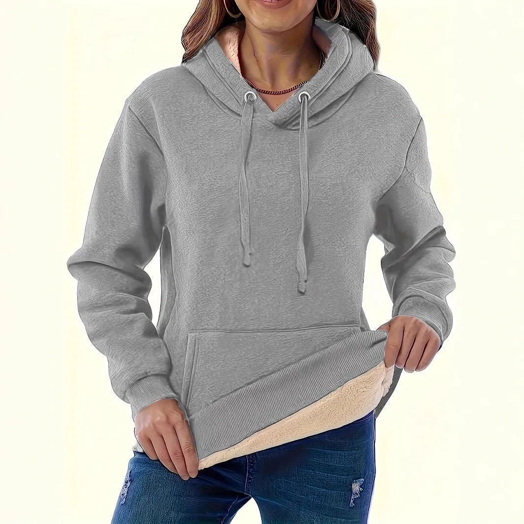 A woman's loose-fit hooded sweater with a raised 3D pattern, shown in a wine red colour.