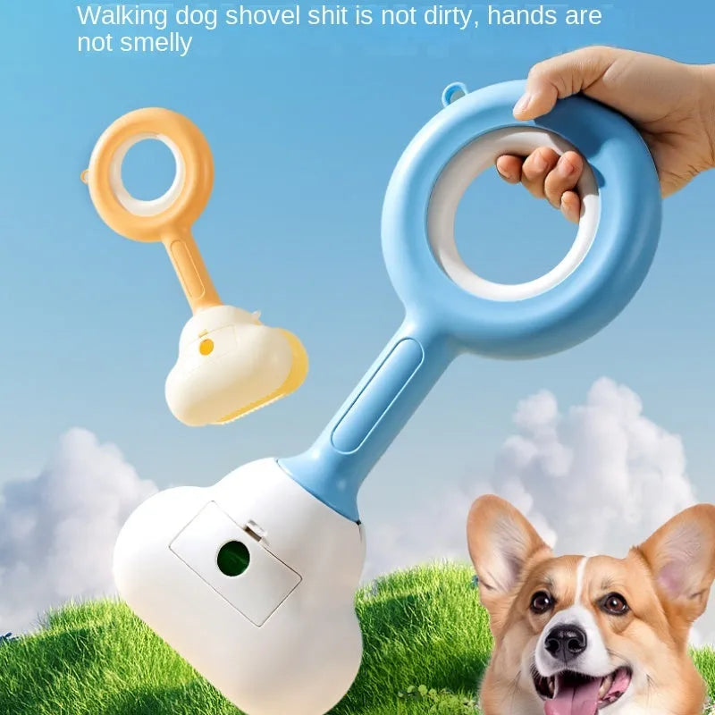White blue and beige coloured cloud jaw design dog pooper scooper on a green lawn.