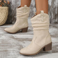 Women's suede mid calf boots with leather stitching detail and a short stout mid heel, shown in lotus root colour